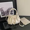 Nova bolsa de ombro plissada estilo coreano 2026, moderna e versátil, bolsa tipo saco doce com toque de luxo, bolsa de mão de nicho