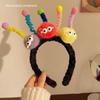 Diadema de pelo con diseño de monstruo pequeño y adorable Twister para otoño e invierno, accesorio para el cabello antideslizante y divertido para mujer.