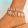 Europa y Estados Unidos pulsera de tobillo con borlas estilo playa oceánica de joyería transfronteriza pulsera de tobillo con gotas de agua perla pluma concha adornos para el pie femenino niña