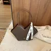 Bolso de axila de nicho estilo coreano para mujer, nuevo modelo 2026, gran capacidad, bolso de hombro simple, bolso tote casual de moda para el día a día