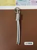 Llavero de cordón de cuero PU transfronterizo, colgante versátil para bolso, accesorios de decoración para botellas de agua y muñecas DIY, llaveros al por mayor