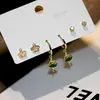 Pendientes pequeños de una semana, populares pendientes pequeños de aguja de plata S925, una tarjeta, tres pares de pendientes de combinación de traje, pendientes de circonita roja de red para mujer