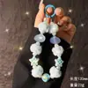 Nova Corrente para Celular com Bolas de Pelo, Estrela do Mar, Concha e Contas Outono e Inverno Moda Feminina Pequeno Cheiro Corrente de Celular de Mão para Pulso