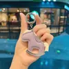 Llavero con incrustaciones de diamantes en stock, colgante de bolso de caballito "Get Rich Quick" de piel sintética, columpio creativo y versátil al por mayor