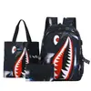 Mochila Escolar Fashion para Novos Alunos Transfronteiriça Padrão de Tubarão Personalizado Impressão Leve Casual Simples Mochila com USB