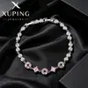 La serie de joyería de lujo de nicho de Xuping incluye pulseras de moneda caladas, pulseras geométricas redondas de aleación de cobre estilo coreano empalmadas para mujer