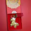 Acessórios de Chaveiro "Fique Rico Instantaneamente" em Ouro Puro 999, Série Ano Novo do Cavalo, Presentes Corporativos Populares Banhados a Ouro, Atacado