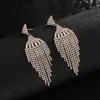 Pendientes Europeos y Americanos Populares Transfronterizos Pendientes de Diamante de Moda Cadena de Garras de Pedrería Borla de Alta Calidad Pendientes de Circonita E776