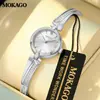 Mokago relógio feminino versátil temperamento mostrador madrepérola pulseira de metal relógio incrustado com strass formato de coração moderno relógio de quartzo atacado