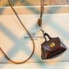 Gargantilha estilo coreano, bolsa para chaves, porta-moedas, colar de nicho, couro, retrô de alta qualidade, pendurado no pescoço, outono e inverno, corrente de lã para mulheres