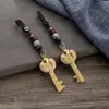 Colgante de llave de bóveda abierta con lingote de pez doble del zodíaco de imitación de latón, colgante de cuerda de nube auspiciosa de los doce zodíacos, venta al por mayor
