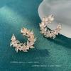Pendientes elegantes de nicho con explosiones transfronterizas, hojas súper brillantes, pendientes ligeros de lujo con gran sentido, pendientes femeninos con diseño de personalidad