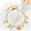Vibrações frescas e curativas à beira-mar, pulseira de joia com pingente de concha banhada a ouro em aço inoxidável e vida marinha com zircônia para mulheres