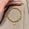 Pulsera de Estrella Disco con Patrón de Martillo Ojo de Gato Cepillado Chapada en Oro Brillante para Mujer con Anillo Corredor Tachonado de Diamantes y Hilo Elástico