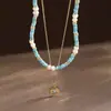 Collar de Doble Capa Nala Perla Turquesa con Colgante de Sol y Ojo del Diablo, Cadena de Clavícula Vintage en Capas para Mujer