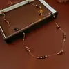 Collar apilado de piedra ojo de tigre artificial redondo Maillard Cadena de suéter de moda retro Otoño e Invierno Ropa de trabajo Collar versátil para mujer