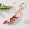 Nuevo Llavero Creativo Lindo de Delfín con Pedrería Accesorios para Bolsos de Mujer Colgante de Metal Accesorios de Joyería de Alta Gama