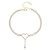 Tobillera con corazón hueco adornado con diamantes de comercio exterior europeo y americano, estilo moderno y de lujo ligero, delicada y elegante, accesorio versátil para el pie de mujer 2026