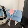 Bolsa mensageira popular de ganga com estrela para menina doce deste ano 2024 nova cor sólida grande capacidade corrente portátil bolsa mensageira
