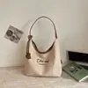 Bolsa de lona de alta moda estilo coreano, novo modelo de verão 2026, bolsa tote moderna e requintada para trabalho e deslocamento, bolsa de ombro