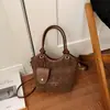 Elegante bolso Mi Home, colección 2026 para mujer, bolso de hombro de moda, bolso cruzado tipo cubo retro moderno