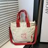 Bolsa de Lona con Bloques de Color Coreana 2026 Verano Nuevo Linda Casual Versátil Cruzada de Hombro de Moda Popular para Viajar