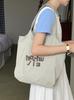 Bolsa de Relaxamento Preguiçoso 2025 Nova Deslocamento Diário Casual Combina com Tudo Estudante Lona Única Letras Bolsa Tote