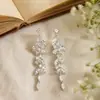 Brincos Elegantes com Franjas e Zircônia para Mulheres com Rosto Quadrado ou Redondo, Apresentando Efeito Emagrecedor, Design de Luxo Leve de Nicho, Brincos de Tarraxa Versáteis e Estilosos