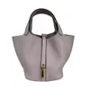 Bolso cesta de piel de vacuno de alta gama con acabado TC para mujer, bolso de mano de cuero genuino de 18 cm con cierre de cobre genuino, bolso tipo cubo