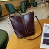 Bolsa feminina de couro genuíno 2026 nova bolsa de balde, bolsa de ombro, axila e transversal versátil de alta qualidade para mulheres