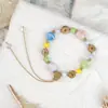 Originário da fonte, pulseira de cerâmica tecida, design de nicho, toque de alta qualidade, doce e versátil, pulseira artística de concha do mar para mulheres