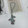 Colgante de Bolso de Oso Perezoso Lindo de Frijol de Dibujos Animados Llavero de Cuero de Diseño Creativo de Nicho Adorno de Regalo