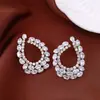 Pendientes de borla con flor de trébol de circonita vintage con un toque de alta gama, pendientes versátiles y de moda al por mayor