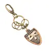 Llavero de coche de regalo creativo llavero de máscara punk vintage de bronce llavero de cuero genuino colgante para mochila de mujer