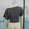 2026 Moda europea y americana para mujer Amazon nuevo top sexy corto de manga corta de color liso, cuello asimétrico, hombros descubiertos, manga ancha, entallado a la cintura