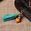 Accesorios pequeños colgantes de lado estilo Tíbet, hechos a mano con hueso de vaca y ágata roja del sur, con borlas, adornos decorativos y colgantes