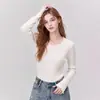 Top de punto de manga larga con cuello redondo y volantes de color albaricoque para mujer, nuevo estilo principios de otoño 2026, de alta gama, corte ajustado, favorecedor, como prenda interior