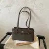 Colección de otoño 2026 transfronteriza: bolso de hombro de nicho de alta gama para mujer, estilo retro para ir al trabajo, bolso de axila, bolso tote casual