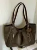 Bolsa de mano Shuai Mijia estilo coreano retro artístico estilo universitario para mujer, nueva moda 2026 bolso de hombro de gran capacidad
