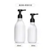 Botella blanca de bomba cosmética de 300 ml en stock, botella vacía de gel de ducha y champú de alta estética de 500 ml