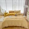 Oferta especial estilo luxo leve transmissão ao vivo conjunto de quatro peças cor sólida sono nu nórdico simples escovado amigo da pele fábrica de Nantong roupa de cama