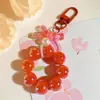 Llavero Colgante de Coche con Lazo de Perlas Electrochapado Color Caramelo Pintura para Hornear Hebilla Pequeña para Puerta Accesorios de Perla Bolsa