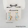 Brincos anel gota de óleo flor borboleta cor ouro 18k banhados a cobre design de nicho brincos transfronteiriços europeus e americanos mulheres atacado
