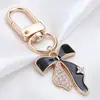 Llavero de Mariposa de Esmalte Blanco y Negro de Gama Alta, Colgante Completo de Diamante, Mariposa Combinada con Colgante de Oro, Llavero DIY, Colgante Pequeño