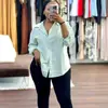 Roupas Femininas Transfronteiriças Europeias e Americanas 2026 Primavera/Verão Novo Design de Moda Blusa Top Listrada Irregular Solta de Manga Longa