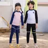 Traje de baño mediano y grande para niños y niñas, pantalones largos de manga larga, nuevo, protección solar, secado rápido, traje de buceo dividido, traje de baño