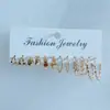 Set de Aretes de Moda Metálicos de Venta Caliente Transfronterizo Europeo y Americano con Elementos Creativos de Corazón Hueco y Aretes Geométricos Retorcidos