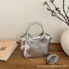 Bolso de mujer de gran capacidad 2026 nuevo bolso de moda estilo coreano moderno para mujer, bolso de hombro versátil de nicho, bolso tipo cubo