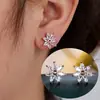 Nuevos Pendientes con Forma de Flor de Siete Pétalos con Circonia en Forma de Ojo de Caballo como Pétalos y un Diseño Circular Hueco en el Centro