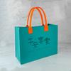 Exposición de Personalización de Bolsas de Fieltro Corporativo 2027 Bolso Tote de Fieltro Año del Cordero Bolso de Mano Publicitario de Fieltro Logo Personalizado